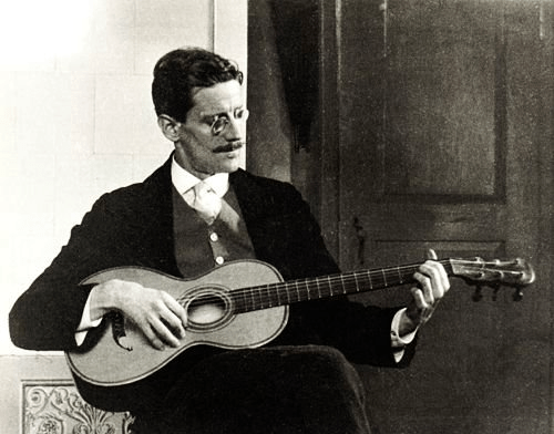 James Joyce cuts sick on a guitar.